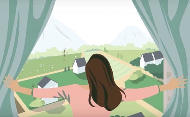 girl looking out window to neighborhood